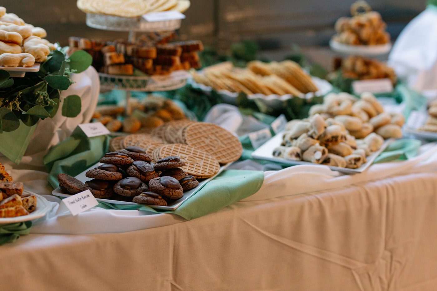 Italian cookie display table with greenery